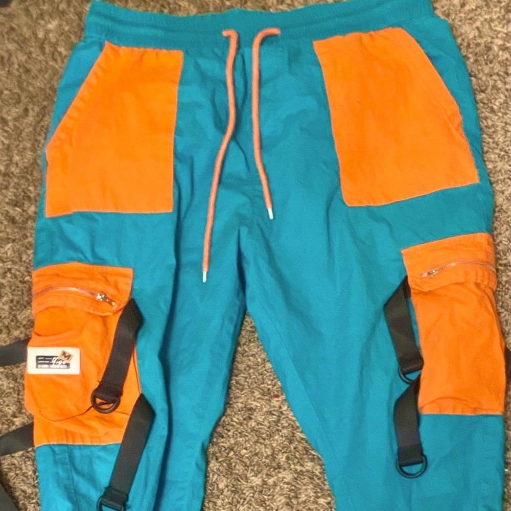Very good quality techwear pants orange and teal color